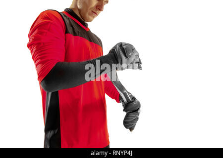 One male soccer player goalkeeper standing at studio. Silhouette isolated on white studio background Stock Photo