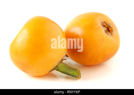 Ripe loquat or Eriobotrya japonica isolated on white background. Stock Photo