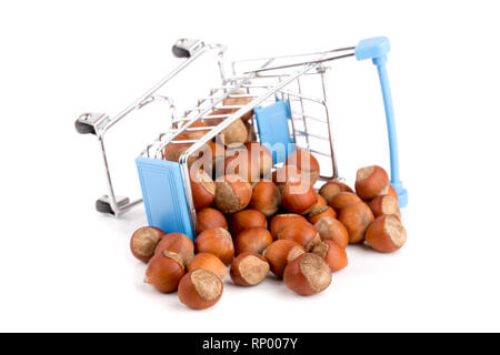 hazelnut in a shopping cart isolated on white background. Stock Photo
