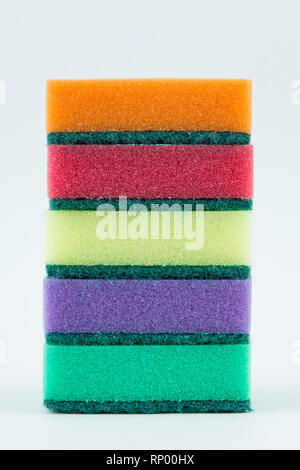 Multicolored sponges for washing dishes on white isolated background. Stock Photo