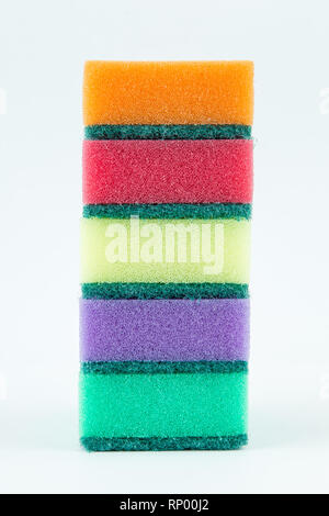 Multicolored sponges for washing dishes on white isolated background. Stock Photo