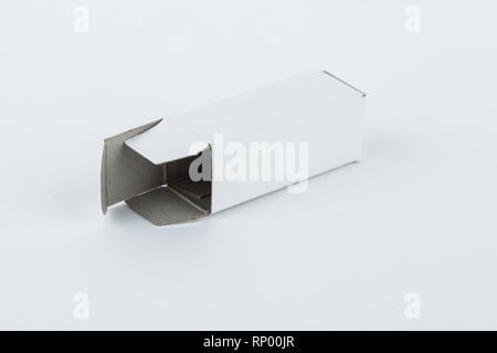 Close up of a small white cardboard box , isolated on white background Stock Photo