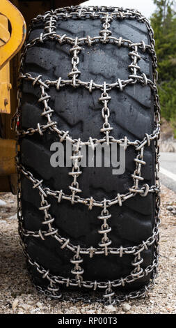 Large wheel loader with tire chains in a quarry Stock Photo - Alamy