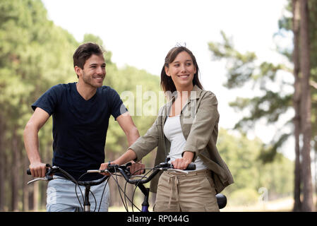 Young couple resting on bicycles Stock Photo