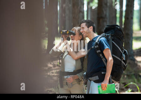 Young couple hiking in forest Stock Photo