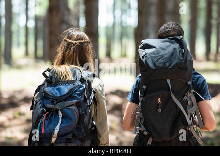 Young couple hiking in forest Stock Photo