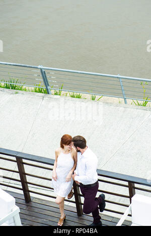Couple standing on hotel balcony Stock Photo