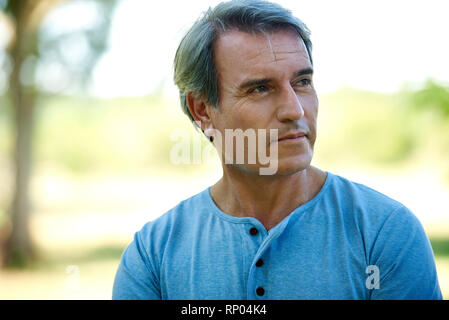 Close-up of a mature man standing outdoors Stock Photo