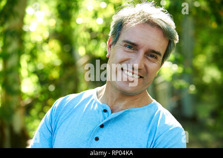 Close-up of a mature man standing outdoors Stock Photo
