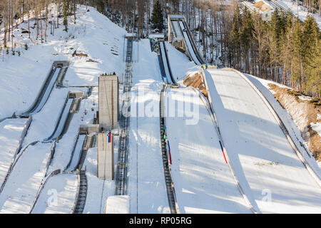 Ski jumps in Planica Nordic Center, complex of ski jump hills sunny winter day. Planica is famous ski jumping venue with Flying hill of Gori ek brothe Stock Photo