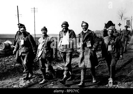 Alternative Title: Official photograph taken on the British Western Front in France : The German offensive - The spirit of our army  Description: keep smiling, carry on! Wounded just arriving from the fighting line leaving the Casualty Clearing Station.  Date Created: 1914  Photo Credit: UBC Library Stock Photo