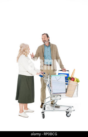 retired husband talking with wife holding shopping trolley isolated on white Stock Photo