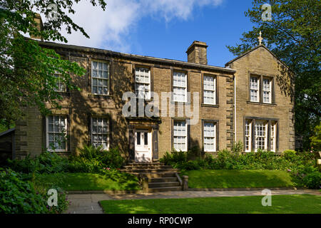 Bronte Parsonage Museum & sunny garden - historic house where Bronte family lived (literary & cultural heritage) - Haworth, West Yorkshire, England UK Stock Photo