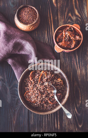 Portion of red quinoa with sun-dried tomatoes: top view Stock Photo