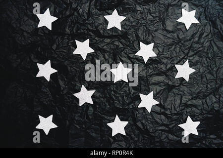 Fake sky night doing with silver stars and crumpled black paper Stock Photo