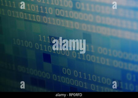computer block of binary code on blue pixel background. light and dark multiple shade and tone of blue pixel blocks. soft focus, selective focus and b Stock Photo
