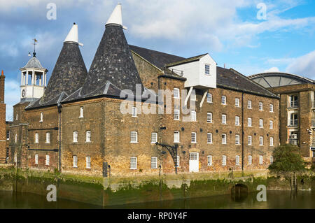 The historic Three Mills tidal mill on the River Lea at Bromley-by-Bow, East London UK Stock Photo