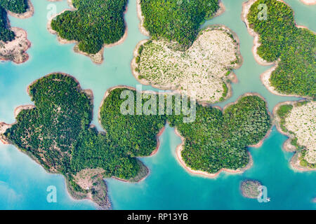 (View from above) Stunning aerial view of a beautiful group of island in Nam Ngum Reservoir in Thalat located in northern Laos. Stock Photo