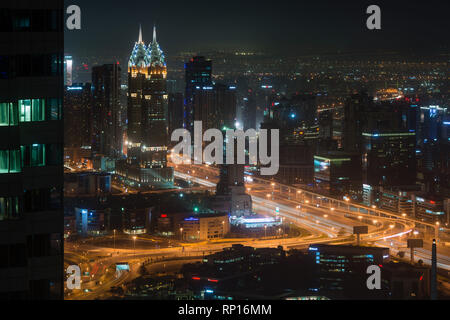 DUBAI, UAE - February 17, 2018: Night view of streets near Business Central Towers or the Al Kazim Towers in Dubai, United Arab Emirates Stock Photo
