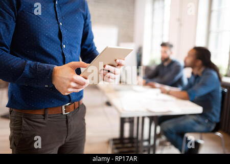 Picture of businessman using digital tablet in office Stock Photo