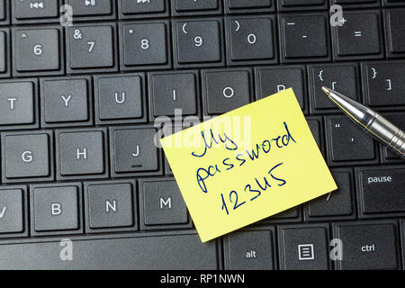 Password security. Office sticker on the laptop keyboard. Stock Photo