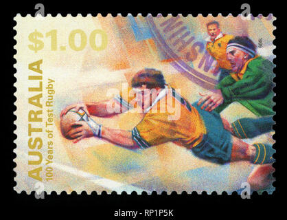 AUSTRALIA - CIRCA 1999: A Stamp printed in AUSTRALIA shows the Diving with ball, 100 Years of Test Rugby, series, circa 1999. Stock Photo