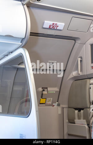 Exit lightbox signage on airplane, escape way of life. way to survive concept Stock Photo