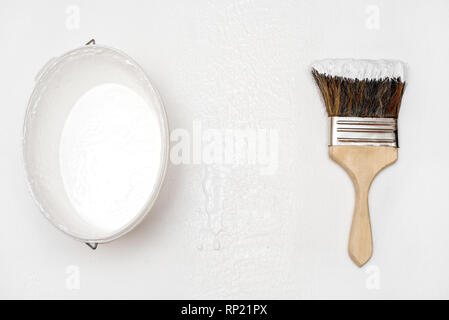 brush lies on a textured wooden white surface Stock Photo