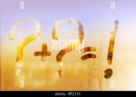 sunny summer rain, on the sweaty glass question mark, exclamation, and the sign is equal. background Stock Photo