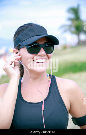 Portrait of a sporty Latina woman out jogging Stock Photo