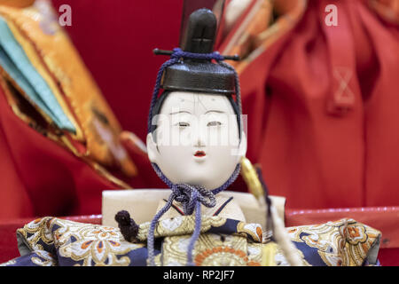 Saitama, Japan. 20th Feb, 2019. A doll adorns a 7 meter in height pyramid on display at the Elumi Kounosu Shopping Mall in Konosu city. Approximately 1,830 Hina-ningyo (a type of Japanese doll) are on display on 31-tiers of a huge pyramid at the main area of the Elumi Kounosu Shopping Mall to celebrate the Hinamatsuri also called Doll's Day or Girls' Day, which is celebrated on March 3rd. Families yearly display the dolls at home to wish for the healthy growth of girls. Konosu city is known as ''Doll Town'' for a number of factories making Japanese dolls. It has 380-year-old history of ma Stock Photo