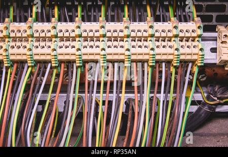 Terminal blocks for electrical connection and earthing terminals for grounding in the control cubicle. Close up. Stock Photo