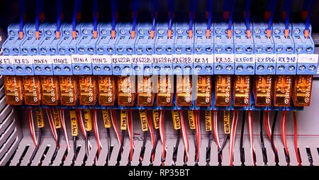 Relay actuators inside the industrial power case. Close up. Stock Photo