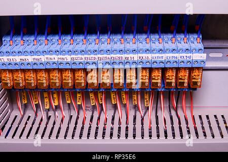 Relay actuators inside the industrial power case. Close up. Stock Photo