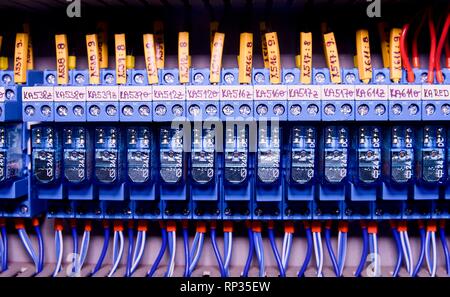 Relay actuators inside the industrial power case. Close up. Stock Photo