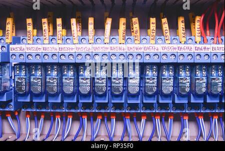 Relay actuators inside the industrial power case. Close up. Stock Photo