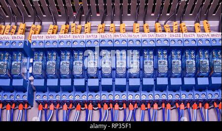 Relay actuators inside the industrial power case. Close up. Stock Photo
