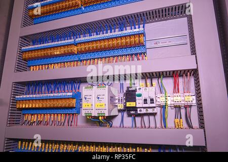 Relay actuators and terminal blocks inside the industrial power case. Close up. Stock Photo