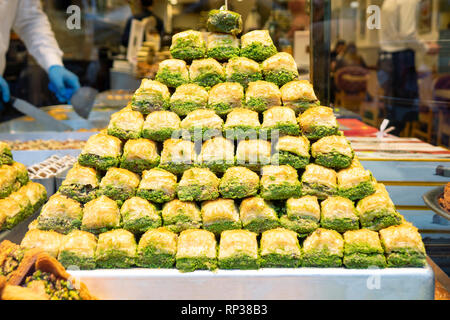 Eastern sweets in a wide range, baklava, Turkish delight with almond, cashew and pistachio nuts on plates Stock Photo