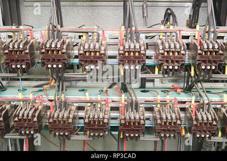 Old contactors in circuit panel. Closeup. Inside electric distribution case. Stock Photo