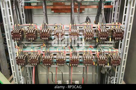 Old contactors in circuit panel. Inside electric distribution case. Stock Photo