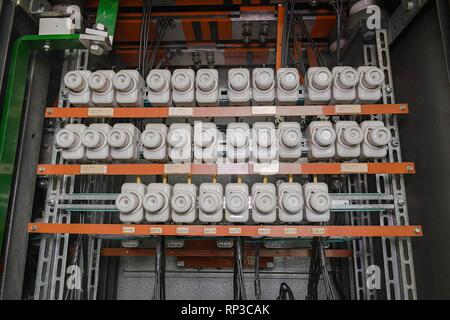 An old fuse box with cables. Old electrical panel, electrical box, control panel. Stock Photo