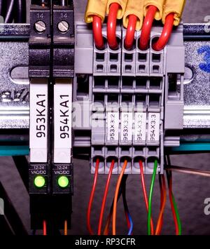 Modern terminal blocks with multi colored wires.  Closeup. Stock Photo