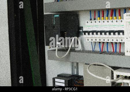 Electrical circuit breakers in an electrical switchboard. Add film grain effect Stock Photo