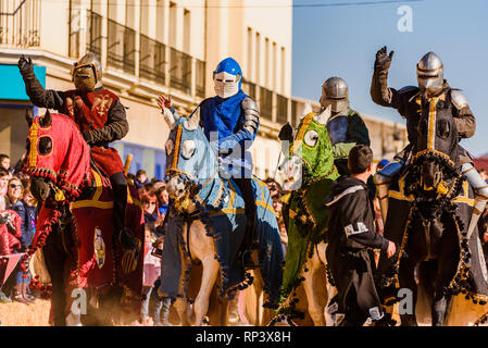 Valencia, Spain - January 27, 2019: An actors dressed as medieval knights in armor riding horses during an exhibition at a children's festival. Stock Photo