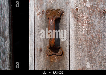 Rusted handles on old barn door. Stock Photo