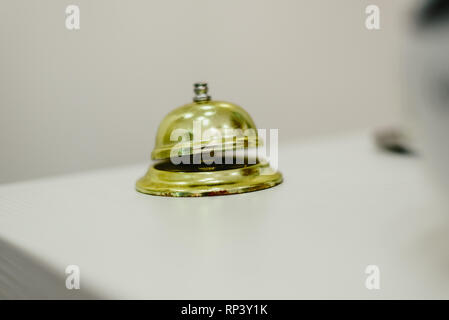Old bell to call the bellman in a hotel, Service bell hotel golden. Stock Photo