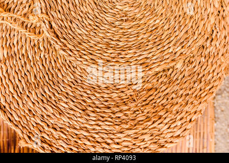 Round esparto mat, natural fiber background. Stock Photo
