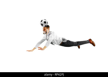 Full length shot of a young businessman playing football isolated on white background. Stock Photo