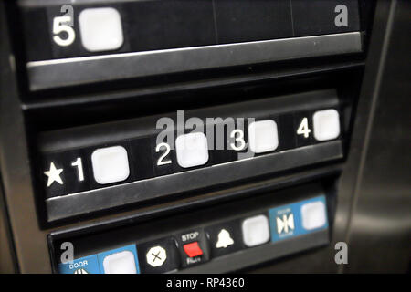 Buttons in elevator to select which level and floor you wish to ride to Stock Photo